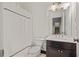 Bathroom features a shower-tub combo with shower curtain, and vanity with sink and mirror at 4356 N Buckhead Ne Dr, Atlanta, GA 30342