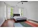 Bedroom with black platform bed, dark hardwood floors, and natural light from two windows at 4356 N Buckhead Ne Dr, Atlanta, GA 30342