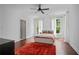 Bright bedroom features hardwood floors, neutral walls, a ceiling fan, and natural light at 4356 N Buckhead Ne Dr, Atlanta, GA 30342