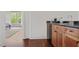 View of bedroom wet bar with wooden cabinets and undercounter refrigerator at 4356 N Buckhead Ne Dr, Atlanta, GA 30342