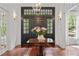 Welcoming foyer featuring dark wood floors, classic lighting, and a view of the front entrance at 4356 N Buckhead Ne Dr, Atlanta, GA 30342
