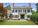 Stately two-story home featuring a manicured front yard, black shutters, and classic architectural details at 4356 N Buckhead Ne Dr, Atlanta, GA 30342