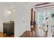 Hallway featuring a powder room, hardwood floors, and stairs leading to the upper level at 4356 N Buckhead Ne Dr, Atlanta, GA 30342
