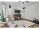 Bright living room features a fireplace, large area rug, and view to the dining area at 4356 N Buckhead Ne Dr, Atlanta, GA 30342