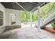 Relax on the backyard patio with a stone floor, with views of the pool and manicured landscape at 4356 N Buckhead Ne Dr, Atlanta, GA 30342