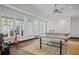 Large recreation room with a ping pong table and lots of light coming from the windows at 4356 N Buckhead Ne Dr, Atlanta, GA 30342