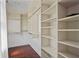 Spacious walk-in closet featuring custom shelving with ample storage and hanging space at 4356 N Buckhead Ne Dr, Atlanta, GA 30342