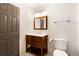 Bathroom featuring a wood vanity with a marble countertop and modern fixtures at 10635 N Edgewater, Johns Creek, GA 30097