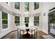 Elegant dining room surrounded by windows providing ample natural light at 10635 N Edgewater, Johns Creek, GA 30097
