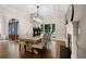 Bright dining room with fireplace, modern chandelier, and ample seating at 10635 N Edgewater, Johns Creek, GA 30097