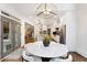 Open-concept dining area adjacent to a modern kitchen with pendant lighting at 10635 N Edgewater, Johns Creek, GA 30097