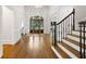 Spacious foyer with hardwood floors, staircase, and elegant chandelier at 10635 N Edgewater, Johns Creek, GA 30097