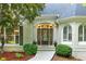 Elegant front entrance features a decorative glass door and arched transom window at 10635 N Edgewater, Johns Creek, GA 30097