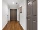 Hallway featuring hardwood floors, neutral paint, and paneled doors at 10635 N Edgewater, Johns Creek, GA 30097