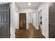 Hallway with hardwood floors and multiple doorways leading to different rooms at 10635 N Edgewater, Johns Creek, GA 30097
