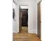 Hallway with hardwood floors leading to bedrooms and closets, offering seamless transition and accessibility at 10635 N Edgewater, Johns Creek, GA 30097
