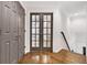 Upstairs hallway with hardwood floors and doors leading to bedrooms and living areas at 10635 N Edgewater, Johns Creek, GA 30097
