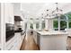 Gourmet kitchen with a view offers a large island and stainless steel appliances at 10635 N Edgewater, Johns Creek, GA 30097