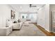Bright living room with modern decor, white sofa, and stylish patterned rug at 10635 N Edgewater, Johns Creek, GA 30097