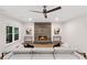Bright living room featuring a modern fireplace and stylish decor at 10635 N Edgewater, Johns Creek, GA 30097