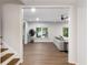Open-concept living room with hardwood floors, a white sofa, and natural light at 10635 N Edgewater, Johns Creek, GA 30097