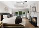 Spacious main bedroom boasts hardwood floors, tray ceiling, fireplace, and access to private balcony at 10635 N Edgewater, Johns Creek, GA 30097