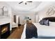 Bright main bedroom with fireplace, hardwood floors, and ample closet space for organized living at 10635 N Edgewater, Johns Creek, GA 30097