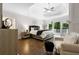 Luxurious main bedroom with tray ceiling, hardwood floors, and private balcony at 10635 N Edgewater, Johns Creek, GA 30097