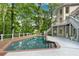 Backyard pool with spacious deck and lush landscaping at 10635 N Edgewater, Johns Creek, GA 30097