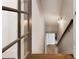 Staircase leading down with wood railing and view to the lower level at 10635 N Edgewater, Johns Creek, GA 30097