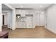Modern wet bar with white cabinets, sink, and open doorway at 10635 N Edgewater, Johns Creek, GA 30097