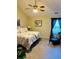 Relaxing bedroom with floral bedding, artwork, and large windows at 1535 Duluth Hwy # 1101, Lawrenceville, GA 30043