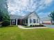 Charming single-story home with manicured lawn, brick accents, and bright sunroom at 1535 Duluth Hwy # 1101, Lawrenceville, GA 30043