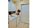 Functional laundry room featuring a washer, dryer, and storage cabinets at 1535 Duluth Hwy # 1101, Lawrenceville, GA 30043