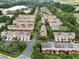 Aerial view of a neighborhood showcasing townhomes, tree-lined streets, and green spaces at 4855 Payson Se Ter # 3, Atlanta, GA 30339
