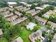An aerial view of townhomes with a community pool and manicured green spaces on a sunny day at 4855 Payson Se Ter # 3, Atlanta, GA 30339
