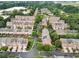 Aerial view of a neighborhood showcasing townhomes, tree-lined streets, and green spaces at 4855 Payson Se Ter # 3, Atlanta, GA 30339