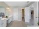 Bright bathroom featuring double vanity, walk-in closet, and neutral tile flooring at 4855 Payson Se Ter # 3, Atlanta, GA 30339