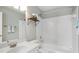 Bathroom featuring vanity, mirror and tub with white tiling at 4855 Payson Se Ter # 3, Atlanta, GA 30339