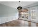 Dining area with crown molding, modern pendant lighting, and a patio door at 4855 Payson Se Ter # 3, Atlanta, GA 30339