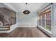 Open dining room with natural light, hardwood floors, and a modern light fixture at 4855 Payson Se Ter # 3, Atlanta, GA 30339