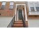 Close-up of the front door and brick stairs leading to the covered entrance at 4855 Payson Se Ter # 3, Atlanta, GA 30339