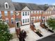 Brick townhomes with attached garages, well-maintained landscaping, and welcoming entrances at 4855 Payson Se Ter # 3, Atlanta, GA 30339
