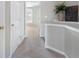 Hallway showcases plant, carpet and neutral paint and opens to another room at 4855 Payson Se Ter # 3, Atlanta, GA 30339