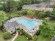 Community pool area with lounge chairs, umbrellas, and nearby clubhouse amenities at 4855 Payson Se Ter # 3, Atlanta, GA 30339