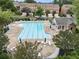 Community pool area with lounge chairs, umbrellas, and nearby clubhouse amenities at 4855 Payson Se Ter # 3, Atlanta, GA 30339