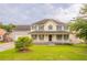 Charming two-story home with a large, inviting front porch and a well-maintained lawn at 5696 Glandor Dr, Mableton, GA 30126