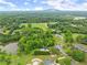 Picturesque aerial shot of lavish homes in wooded area, featuring vast lands and pond, creating a peaceful retreat at 789 Rutland Ct, Lithonia, GA 30058