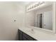 Modern bathroom with stylish vanity, a sink, and lots of light from a decorative vanity light at 789 Rutland Ct, Lithonia, GA 30058