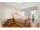 Serene bedroom featuring a comfortable queen bed, stylish nightstand, and ample natural light at 789 Rutland Ct, Lithonia, GA 30058